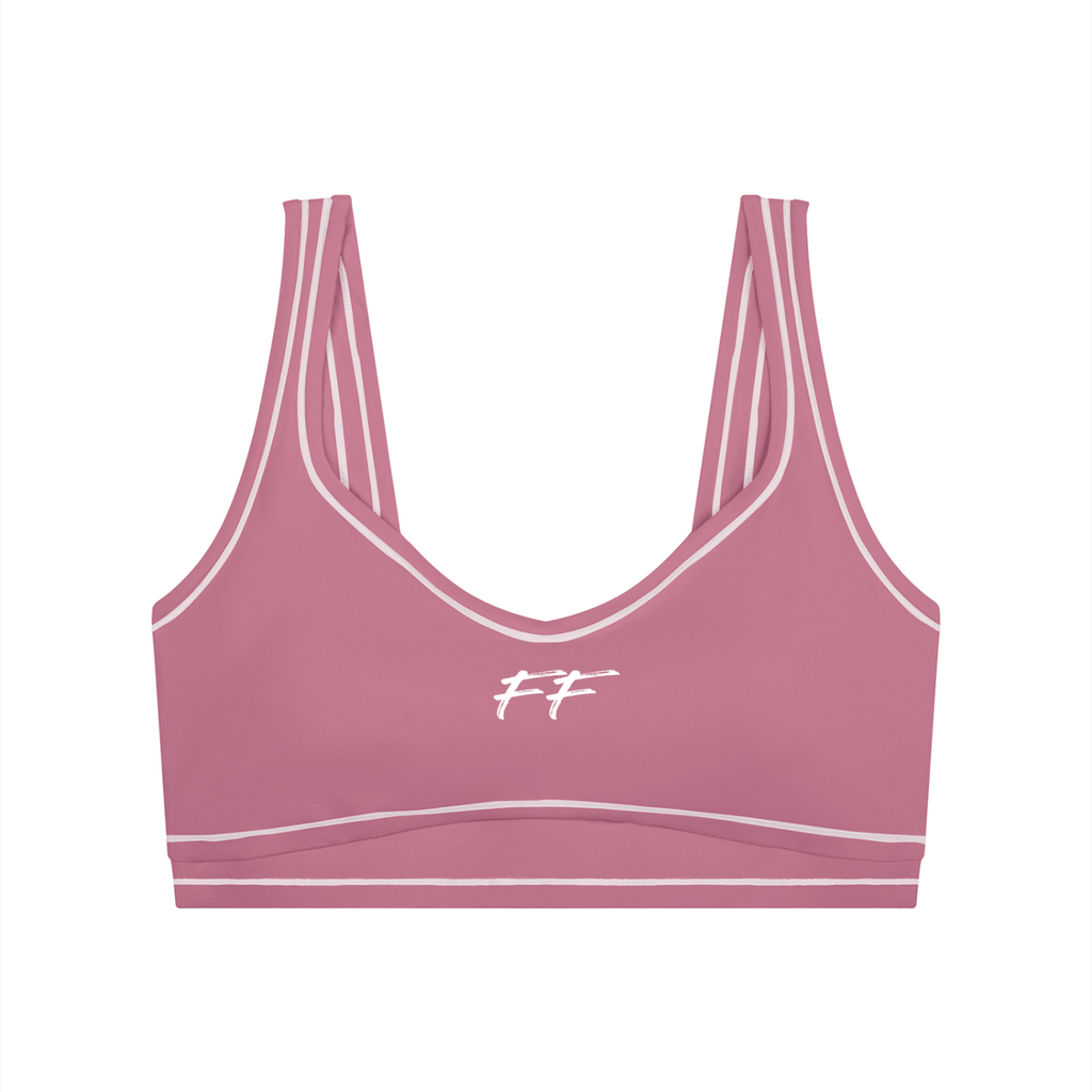 Double Take Topstitching sports bra in dusty pink with light pink trim, seamless shoulders, and a U-neckline.