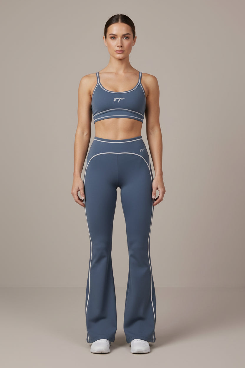 ODMPOD Double Take high-rise flared yoga pants displayed on a model, featuring a comfortable fit and stylish design.