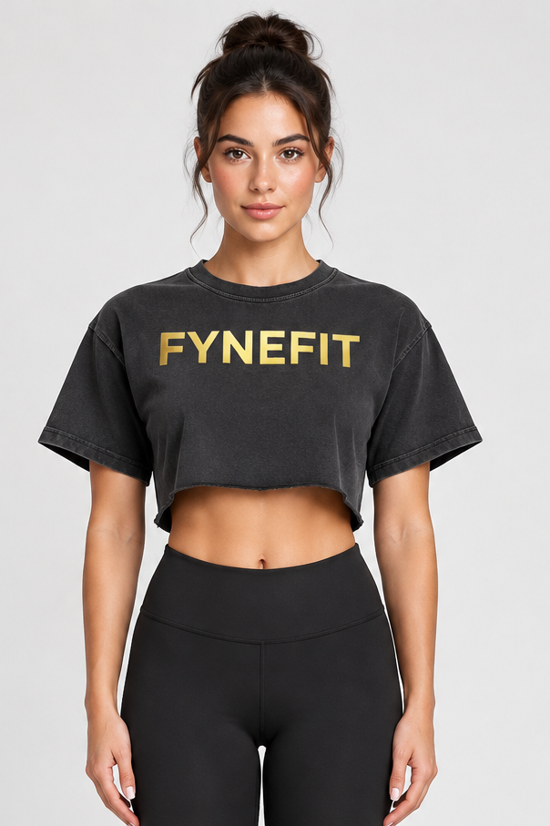 Black crop top with gold logo on model