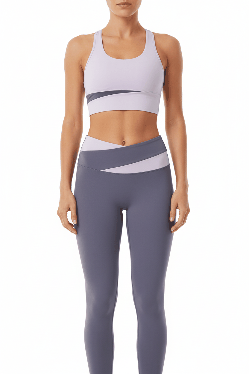 Fitness model in lavender sports bra and slate grey colorblock leggings