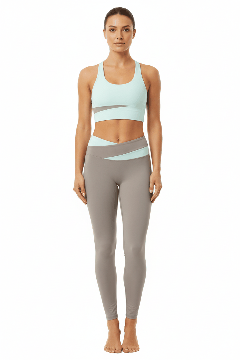 Fitness model in mint sports bra and taupe colorblock leggings