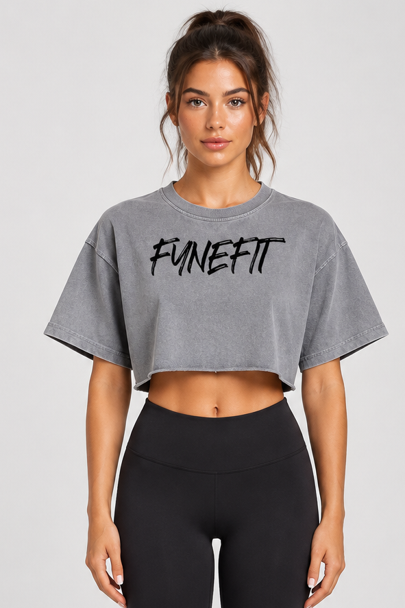 Grey crop top with black logo on model