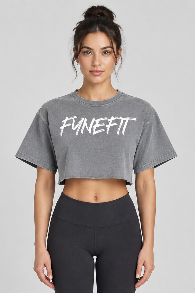 Grey crop top with white logo on model