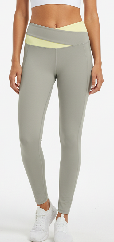 Fitness model wearing FyneFIT light gray and light yellow color block yoga leggings on a plain studio background