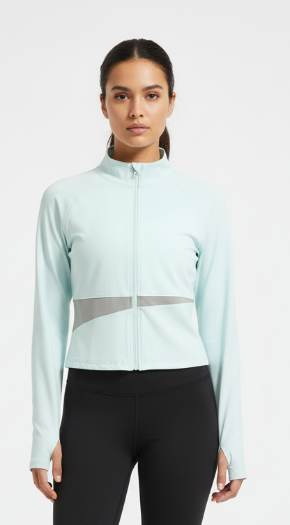 Fitness model wearing FyneFIT light blue and light gray paneled yoga jacket on a plain studio background