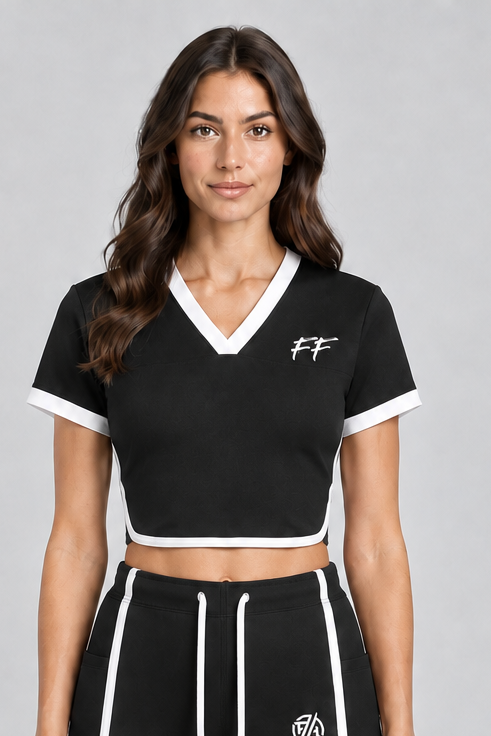 ODMPOD FF Varsity Club Ringer Performance T-Shirt worn by a model, featuring a classic black ringer tee with contrasting collar and sleeves.