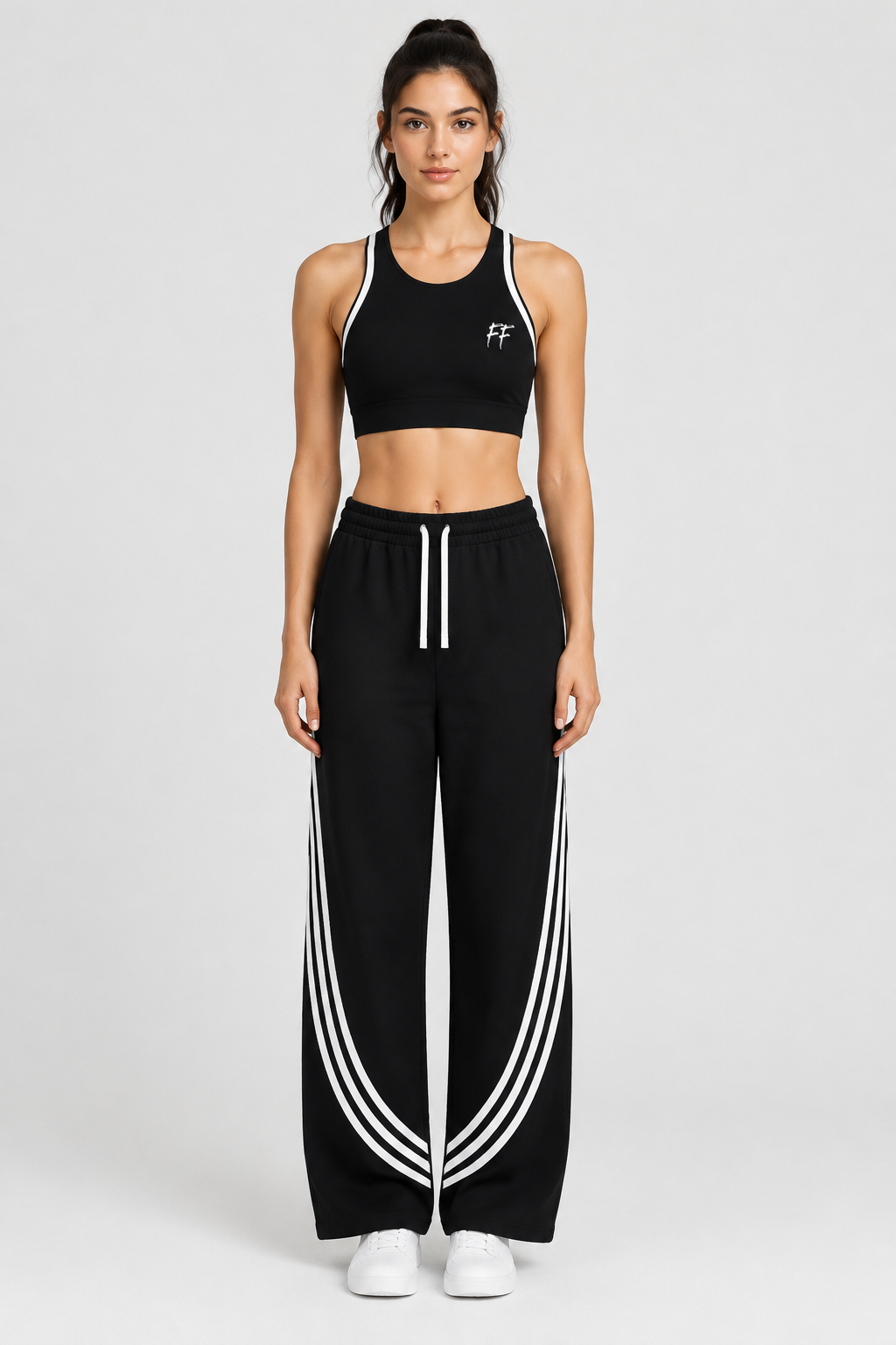 Model wearing the FF halter top and curved-stripe pants with white trainers