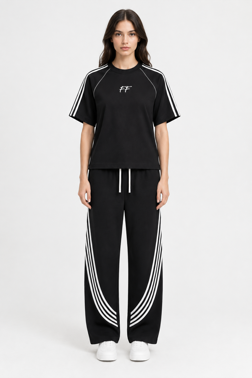Model wearing the FF striped tee and curved-stripe sweatpants with white trainers