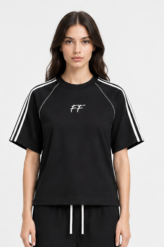 Model wearing ODMPOD FF Varsity Club striped contrast stitch T-shirt with curved stripe sweatpants and white trainers.