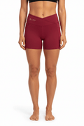 Red women's high rise pocket yoga shorts by FyneFIT, front view showing comfortable fit and functional pockets.